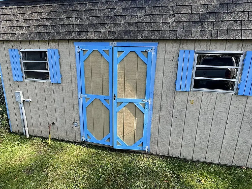 Shed doors rebuilt, rehung, and freshly painted